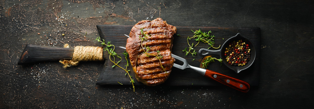 Grilled ribeye steak, fresh herbs and assorted peppercorns