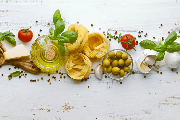 Italian food: pasta, olives olive oil, tomatoes, basil, garlic, cheese