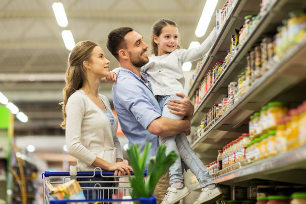 Father, mother, child shopping in supermarket